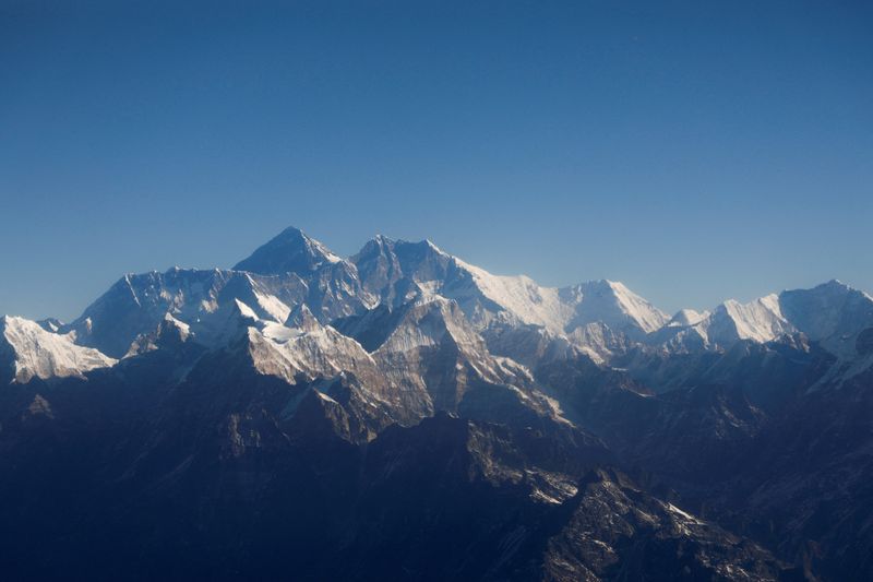 &copy; Reuters. FILE PHOTO: Mount Everest, the world highest peak, and other peaks of the Himalayan range are seen through an aircraft window during a mountain flight from Kathmandu, Nepal January 15, 2020. REUTERS/Monika Deupala//File Photo/File Photo