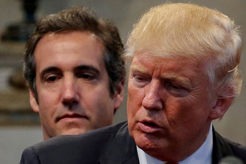 &copy; Reuters. FILE PHOTO: Donald Trump's personal attorney Michael Cohen stands behind Trump as he runs for president while a group of supporters lay hands on Trump in prayer during a campaign stop at the New Spirit Revival Center church in Cleveland Heights, Ohio, U.S