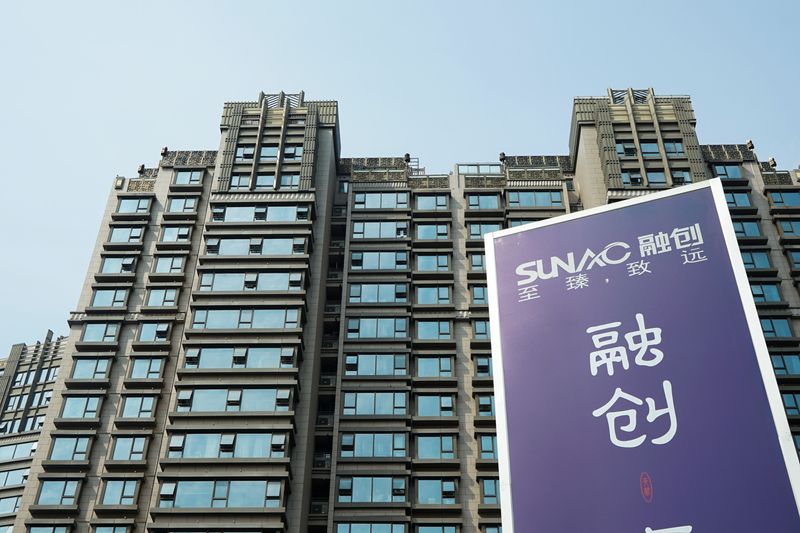 &copy; Reuters. FILE PHOTO: An advertisement of property developer Sunac China Holdings is seen at a residential complex in Shanghai, China March 25, 2018. Picture taken March 25, 2018.  REUTERS/Stringer  