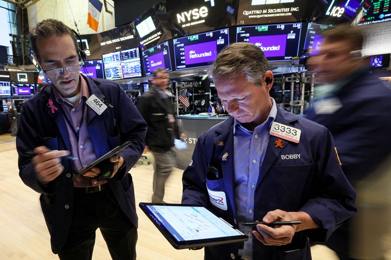 &copy; Reuters. FILE PHOTO: Traders work on the floor of the New York Stock Exchange (NYSE) in New York City, U.S., March 23, 2023.  REUTERS/Brendan McDermid