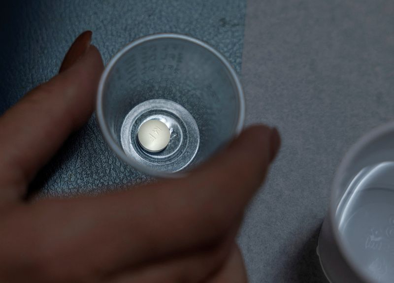 © Reuters. FILE PHOTO: A patient prepares to take mifepristone, the first pill given in a medical abortion, at Women's Reproductive Clinic of New Mexico in Santa Teresa, U.S., January 13, 2023. REUTERS/Evelyn Hockstein/File Photo