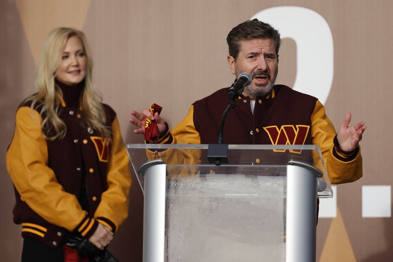 &copy; Reuters. FILE PHOTO: Feb 2, 2022; Landover, MD, USA; Washington Commanders co-owner Dan Snyder speaks as co-owner Tanya Snyder (L) listens during a press conference revealing the Commanders as the new name for the formerly named Washington Football Team at FedEx F