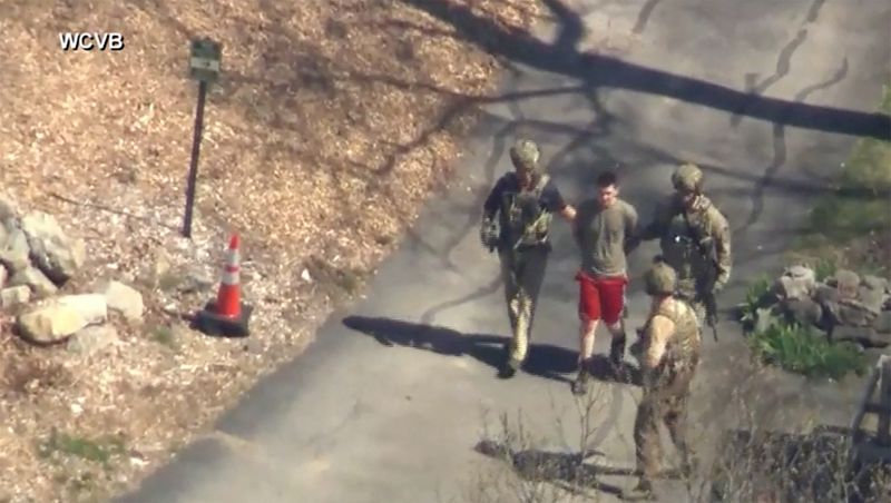 © Reuters. FBI agents arrest Jack Teixeira, an employee of the U.S. Air Force National Guard, in connection with an investigation into the leaks online of classified U.S. documents, outside a residence in this still image taken from video in North Dighton, Massachusetts, U.S., April 13, 2023. WCVB-TV via ABC via REUTERS