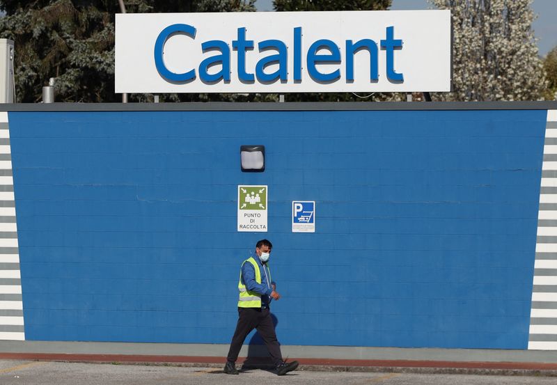 &copy; Reuters. FILE PHOTO: A man walks outside the Catalent plant where millions of doses of the AstraZeneca coronavirus disease (COVID-19) vaccine were reportedly found, in Anagni, Italy, March 24, 2021. REUTERS/Yara Nardi