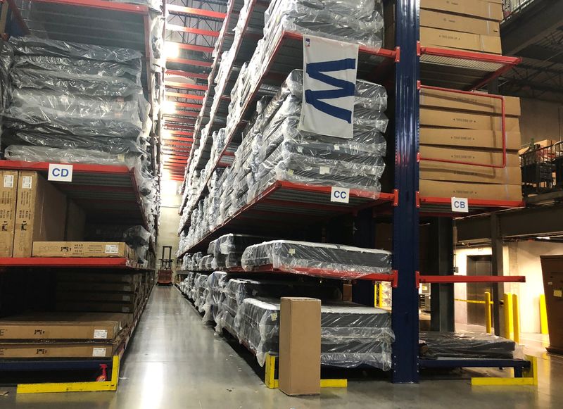 &copy; Reuters. FILE PHOTO: Warehouse workers deal with inventory stacked up to the ceiling at an ABT Electronics Facility in Glenview, Illinois, U.S. December 4, 2018. Picture taken December 4, 2018. To match Insight USA-RETAILERS/TRADE REUTERS/Richa Naidu