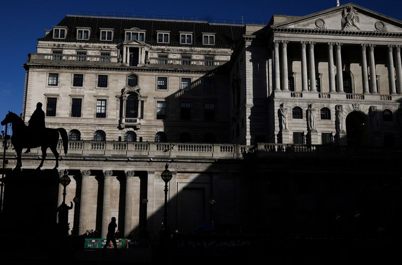 &copy; Reuters. FILE PHOTO: A person walks outside the Bank of England in the City of London financial district in London, Britain, March 23, 2023. REUTERS/Henry Nicholls