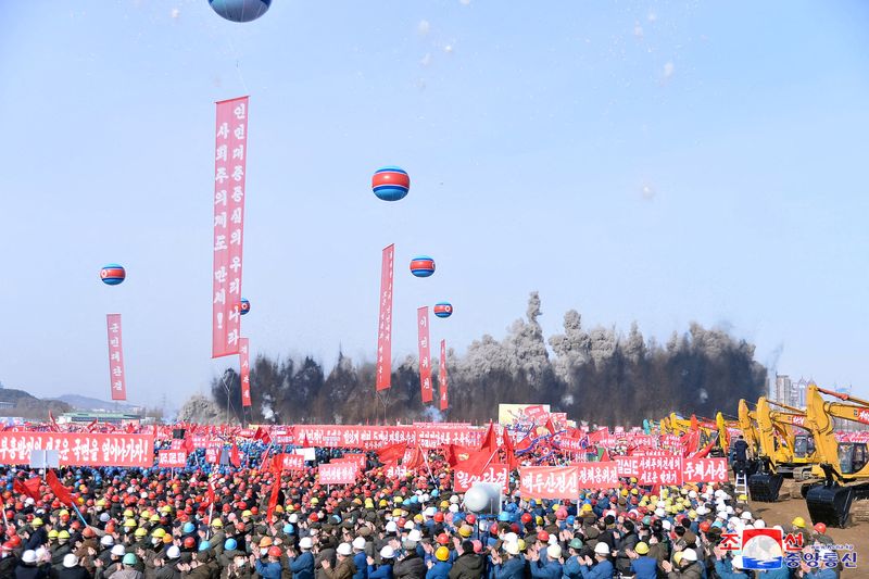 &copy; Reuters. Workers react during the groundbreaking ceremony for new flats in the 2nd phase of the construction project in Hwasong district, in Pyongyang, North Korea, in this photo released on February 15, 2023 by North Korea's Korean Central News Agency (KCNA). KCN