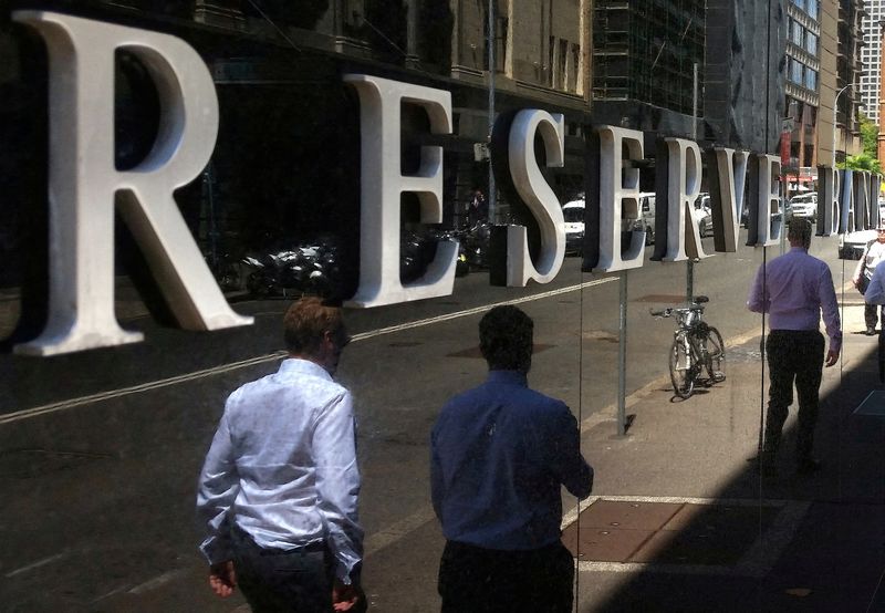 &copy; Reuters. FILE PHOTO: Pedestrians walk past the Reserve Bank of Australia building in central Sydney, Australia, February 10, 2017. REUTERS/Steven Saphore/File Photo