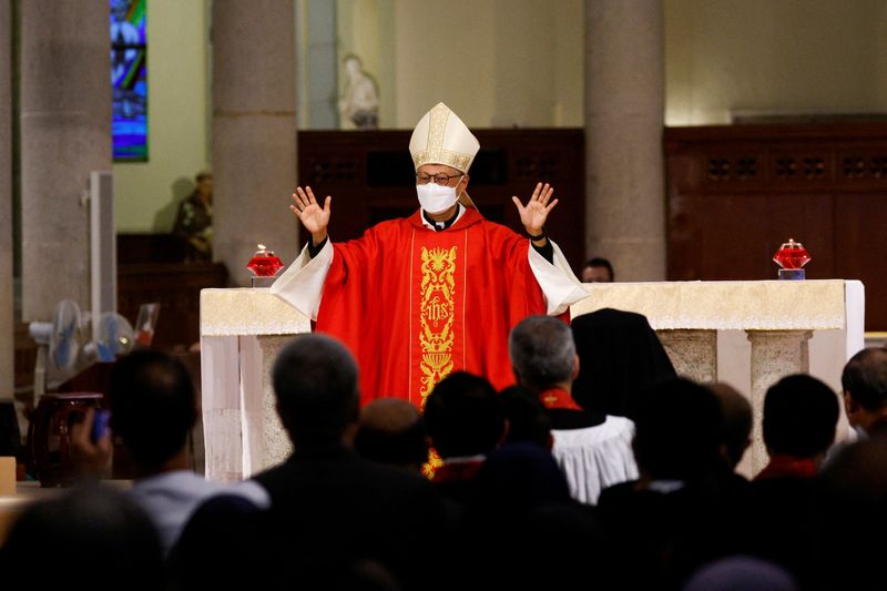 &copy; Reuters. FILE PHOTO: Bishop Stephen Chow gestures during his episcopal ordination in Hong Kong, China December 4, 2021. REUTERS/Tyrone Siu