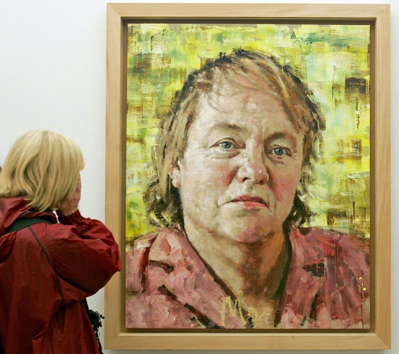 &copy; Reuters. FILE PHOTO: A visitor looks at a painting of British politician Mo Mowlam, painted by John Keane in 2001, at the National Portrait Gallery in London, August 19, 2005. REUTERS/Toby Melville  TM/SH