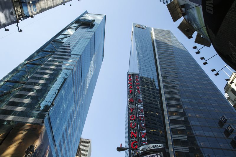 &copy; Reuters. FILE PHOTO: The Ernst & Young building rises above Times Square in New York June 18, 2014.  REUTERS/Lucas Jackson
