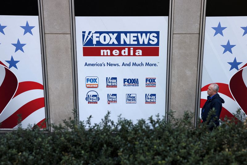 &copy; Reuters. FILE PHOTO: A person walks by Fox News signage posted on the News Corporation building in New York City, U.S. April 12, 2023 REUTERS/Andrew Kelly/File Photo