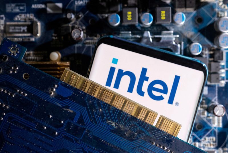 &copy; Reuters. FILE PHOTO: A smartphone with a displayed Intel logo is placed on a computer motherboard in this illustration taken March 6, 2023. REUTERS/Dado Ruvic/Illustration