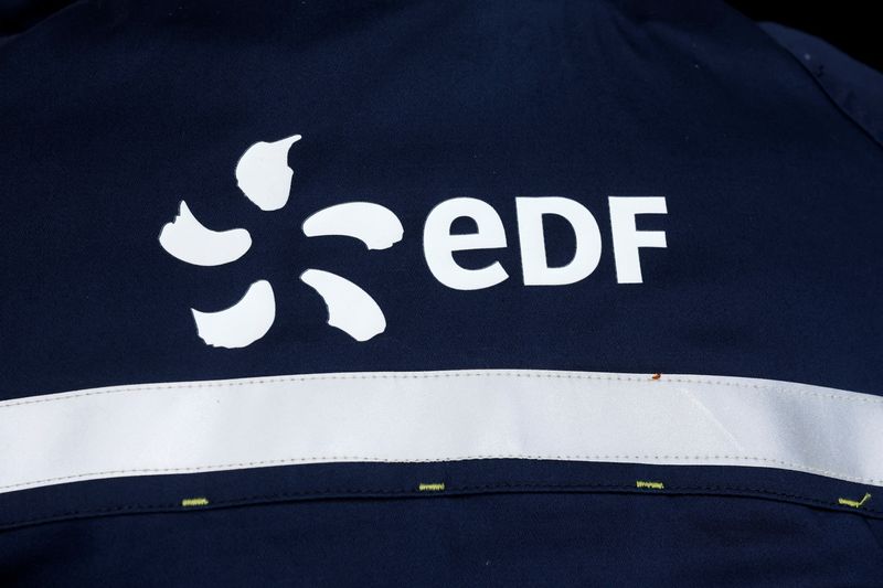 &copy; Reuters. FILE PHOTO: The EDF logo is seen on the back of an employee during a visit at French utility EDF's Penly Nuclear Power Plant in Petit-Caux, near Dieppe, France, December 9, 2022. REUTERS/Benoit Tessier
