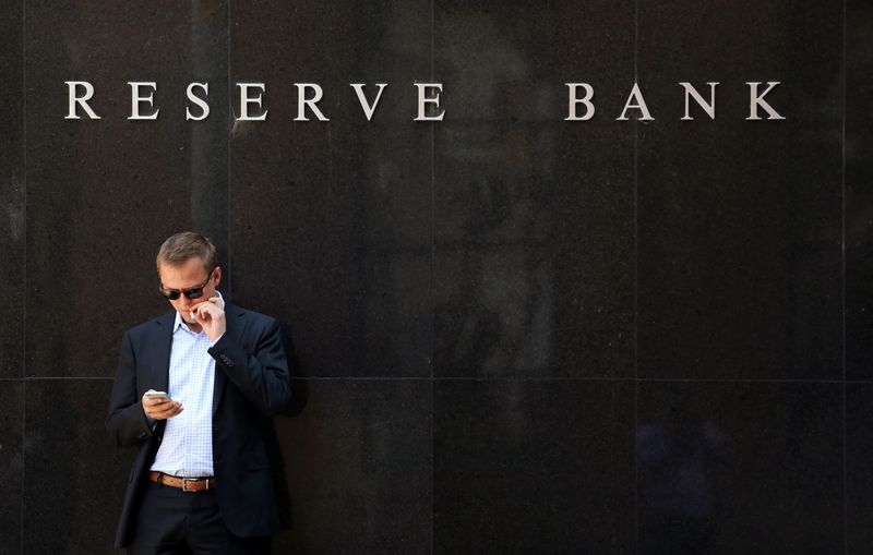 &copy; Reuters. FILE PHOTO: A man smokes next to the Reserve Bank of Australia headquarters in central Sydney, Australia February 6, 2018. REUTERS/Daniel Munoz