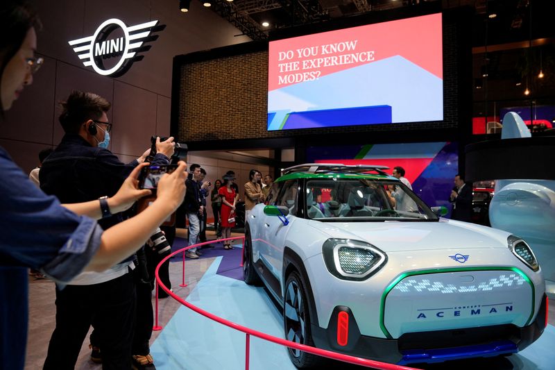 At Shanghai show, auto rivals lure drivers with in-car karaoke, crystal balls