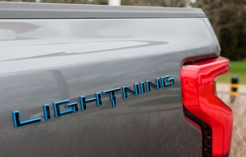 &copy; Reuters. FILE PHOTO: The Lightning logo is seen on the side of an all-new Ford F-150 Lightning electric pickup truck outside the Ford Motor World Headquarters in Dearborn, Michigan, U.S., April 26, 2022. REUTERS/ Rebecca Cook