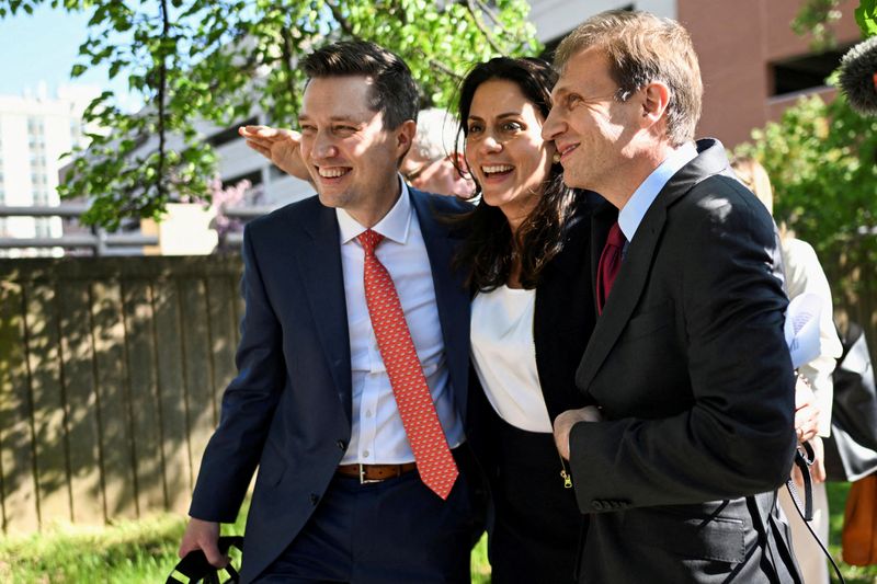 &copy; Reuters. FILE PHOTO: Dominion lawyers embrace after Dominion Voting Systems and Fox settled the defamation lawsuit over Fox's coverage of debunked election-rigging claims, in Wilmington, Delaware, U.S., April 18, 2023.  REUTERS/Mark Makela/File Photo