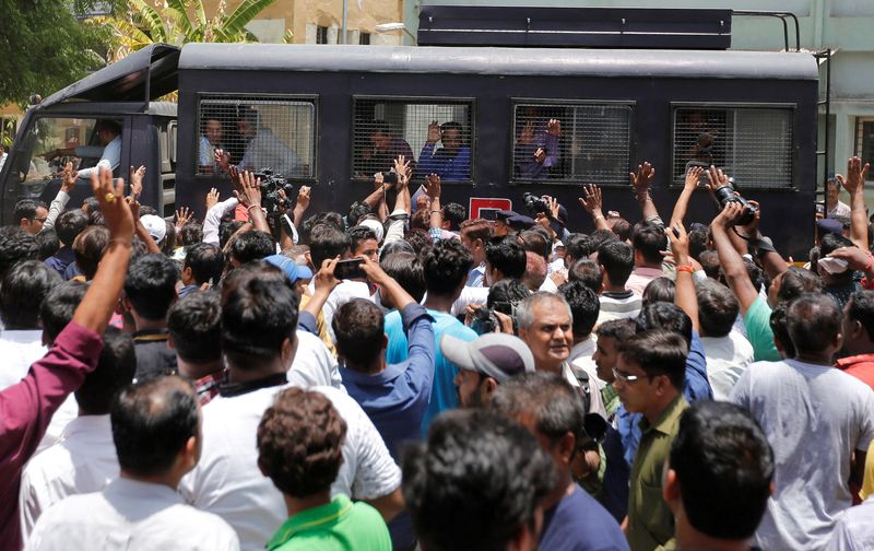 © Reuters. FILE PHOTO: A police van transports some of those convicted in connection with a riot in Gujarat in 2002, outside a court after the ruling in Ahmedabad, India June 2, 2016. REUTERS/Amit Dave