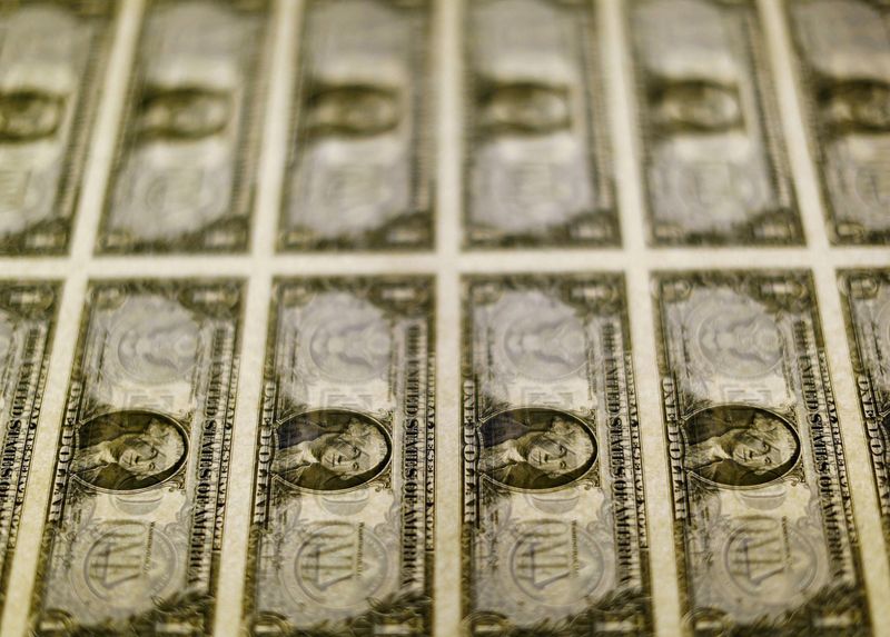 &copy; Reuters. FILE PHOTO: United States one dollar bills are seen on a light table at the Bureau of Engraving and Printing in Washington in this November 14, 2014, file photo. REUTERS/Gary Cameron