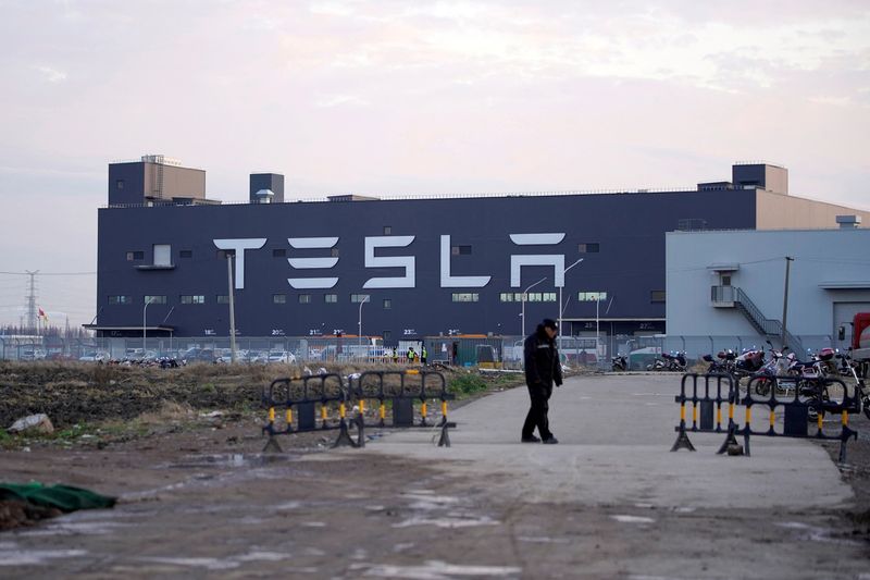&copy; Reuters. FILE PHOTO: A Tesla sign is seen on the Shanghai Gigafactory of the U.S. electric car maker before a delivery ceremony in Shanghai, China January 7, 2020. REUTERS/Aly Song/File Photo