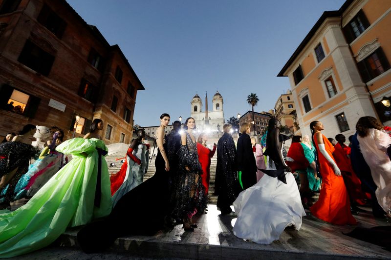 &copy; Reuters. FILE PHOTO: Models present creations from Valentino's "The Beginning" Fall-Winter 2022/2023 Haute Couture collection during a show on a catwalk on the Spanish Steps in the historic center of Rome, Italy July 8, 2022. REUTERS/Yara Nardi