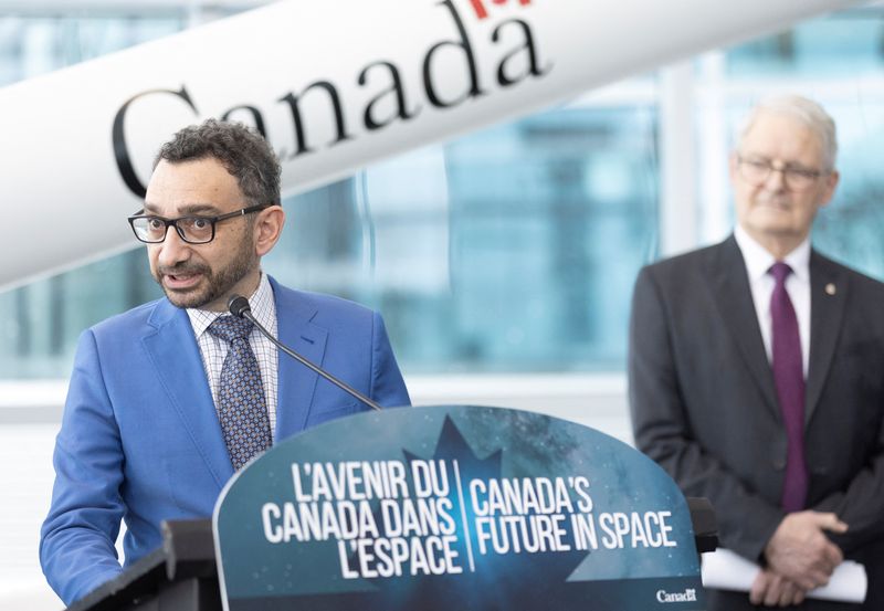 &copy; Reuters. FILE PHOTO: Canada's Minister of Transport Omar Alghabra speaks as member of parliament Marc Garneau looks on during an announcement supporting Canada commercial space launches at the Canadian Space Agency in Longueuil, Quebec, Canada, January 20, 2023. R