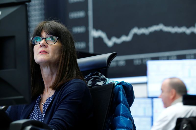 &copy; Reuters. FILE PHOTO: A trader works at Frankfurt's stock exchange in Frankfurt, Germany, March 12, 2020.    REUTERS/Ralph Orlowski