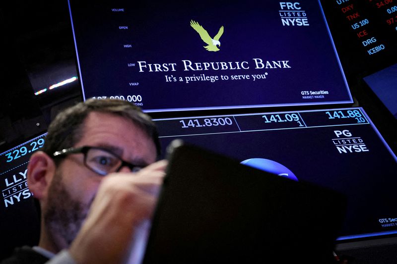 &copy; Reuters. FILE PHOTO: A trader works at the post where First Republic Bank stock is traded on the floor of the New York Stock Exchange (NYSE) in New York City, U.S., March 16, 2023.  REUTERS/Brendan McDermid/File Photo