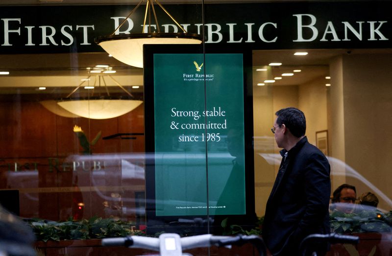 &copy; Reuters. FILE PHOTO: A person walks past a First Republic Bank branch in Midtown Manhattan in New York City, New York, U.S., March 13, 2023. REUTERS/Mike Segar/File Photo