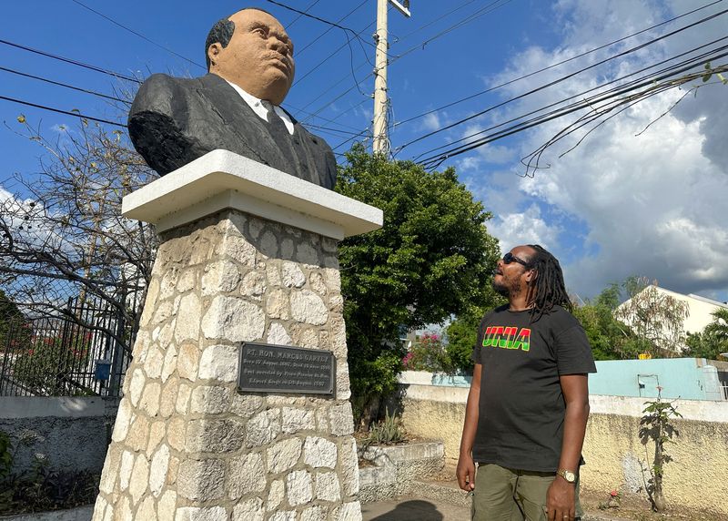&copy; Reuters. Steven Golding, President of the Universal Negro Improvement Association and African Communities League, a black nationalist fraternal organization founded in Jamaica by Marcus Garvey, admires a bust of Garvey in Kingston, Jamaica March 21, 2023. REUTERS/