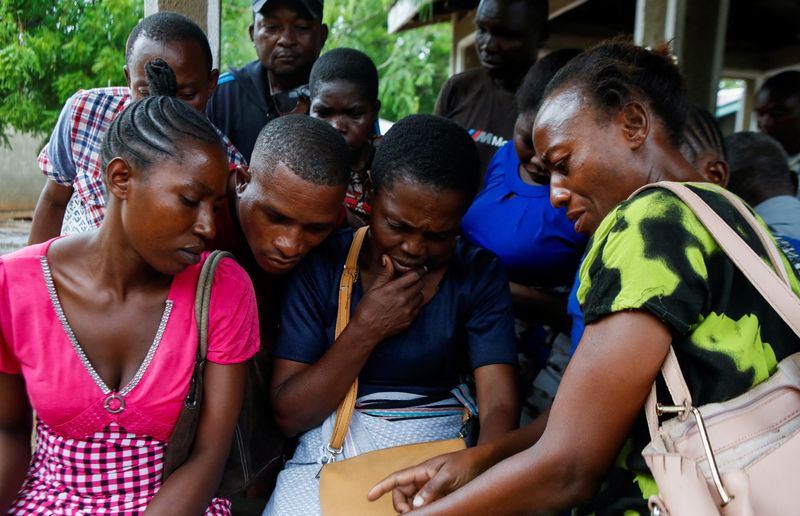 © Reuters. Relatives of followers of a Christian cult named 