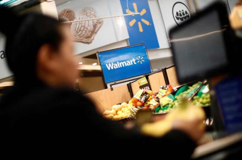 &copy; Reuters. FILE PHOTO: A customer shops inside a Walmart store in Mexico City, Mexico March 28, 2019. REUTERS/Edgard Garrido/File Photo
