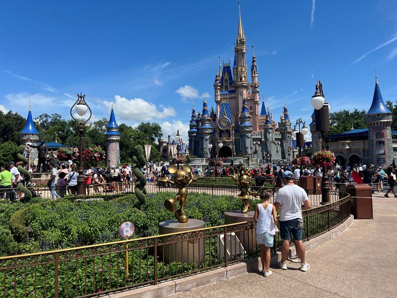 &copy; Reuters. FILE PHOTO: People gather ahead of the "Festival of Fantasy" parade at the Walt Disney World Magic Kingdom theme park in Orlando, Florida, U.S. July 30, 2022.  REUTERS/Octavio Jones/File Photo