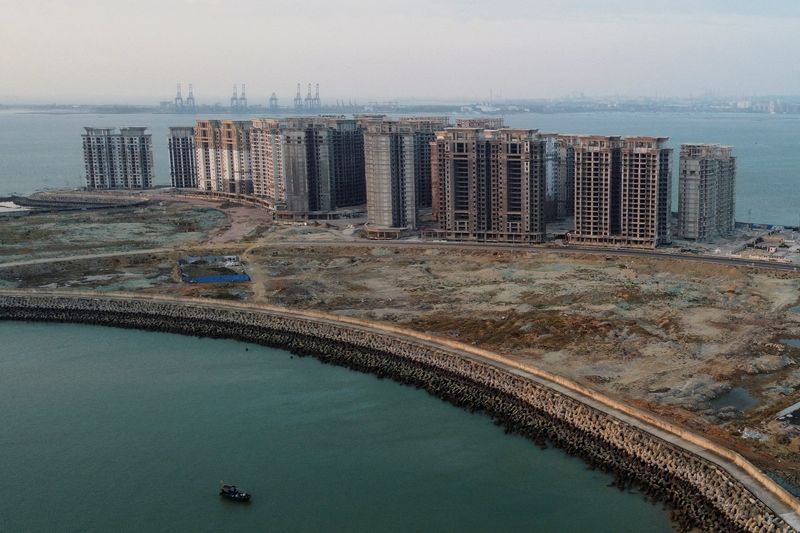 &copy; Reuters. FILE PHOTO: An aerial view shows the 39 buildings developed by China Evergrande Group that authorities have issued demolition order on, on the manmade Ocean Flower Island in Danzhou, Hainan province, China January 6, 2022. Picture taken with a drone. REUT