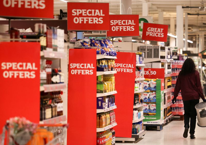 &copy; Reuters. FILE PHOTO: A employee walks inside a Sainsbury’s supermarket in Richmond, west London, Britain, June 27, 2022. Picture taken June 27, 2022. REUTERS/Henry Nicholls/File Photo