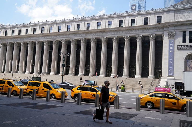 © Reuters. FILE PHOTO: Taxis are parked across the street from the U.S. Postal Service Farley building that Facebook announced it would lease for office space in the Manhattan borough of New York City, New York, U.S., August 5, 2020. REUTERS/Carlo Allegri/File Photo