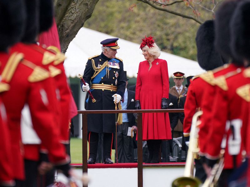 &copy; Reuters. FILE PHOTO: King Charles III and Camilla, the Queen Consort attend a ceremony where they presented new Standards and Colours to the Royal Navy; the Life Guards of the Household Cavalry Mounted Regiment; The King's Company of the Grenadier Guards, and The 