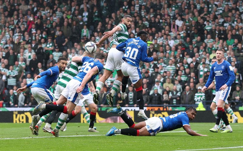 &copy; Reuters. Soccer Football - Scottish Cup Semi Final - Rangers v Celtic - Hampden Park, Glasgow, Scotland, Britain - April 30, 2023 Celtic's Cameron Carter-Vickers  in action with Rangers' Fashion Sakala REUTERS/Russell Cheyne