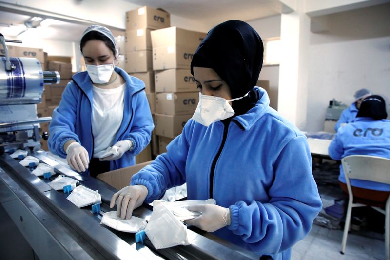 &copy; Reuters. FILE PHOTO: Workers produce face masks as the demand for their production rapidly increased and struggles to meet orders, at a Turkish manufacturer's facility in Istanbul, Turkey, January 30, 2020. REUTERS/Umit Bektas