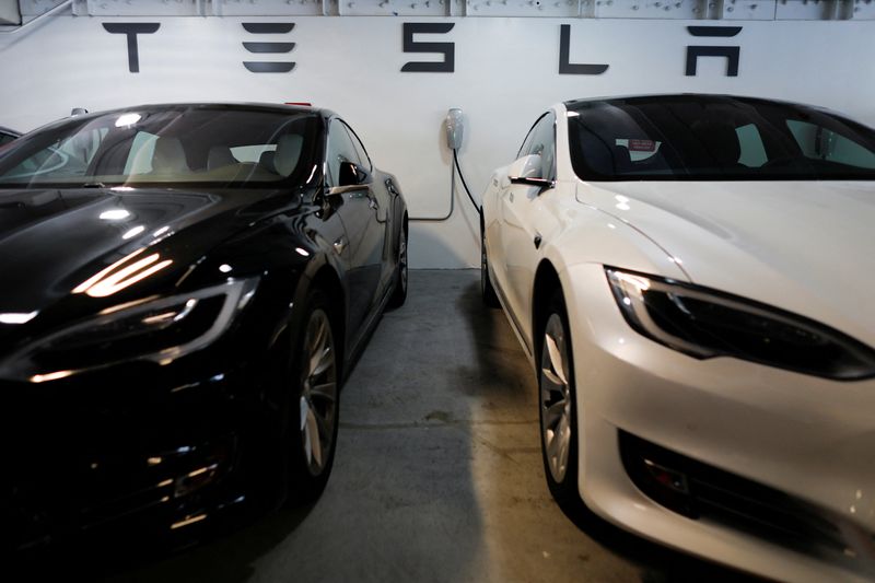 &copy; Reuters. FILE PHOTO: Tesla Model 3s are shown charging in an underground parking lot next to a Tesla store in San Diego,California, U.S., May 30, 2018. REUTERS/Mike Blake/File Photo