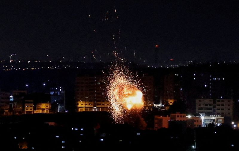 © Reuters. An explosion is seen, following an Israeli air strike in Gaza May 2, 2023. REUTERS/Mohammed Salem     