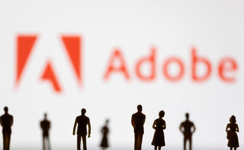 &copy; Reuters. FILE PHOTO: Figurines are seen in front of displayed Adobe logo in this illustration taken June 13, 2022. REUTERS/Dado Ruvic/Illustration