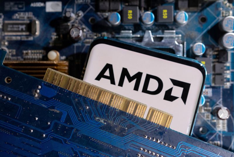 &copy; Reuters. A smartphone with a displayed AMD logo is placed on a computer motherboard in this illustration taken March 6, 2023. REUTERS/Dado Ruvic/Illustration