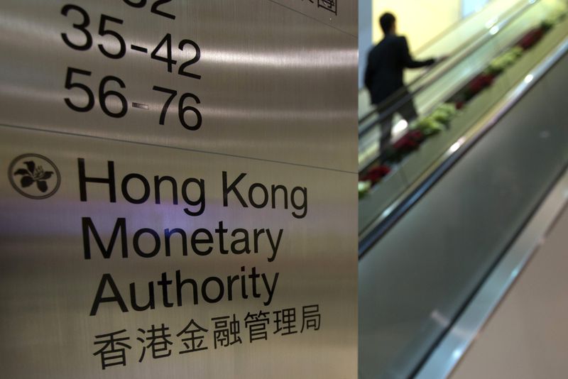 &copy; Reuters. A security guard walks past a directory board of Hong Kong Monetary Authority (HKMA) in Hong Kong December 20, 2012. REUTERS/Tyrone Siu/File Photo