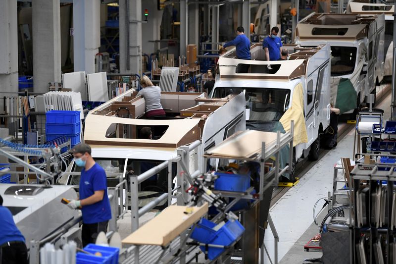 &copy; Reuters. FILE PHOTO: Workers assemble campers at Knaus-Tabbert AG factory in Jandelsbrunn near Passau, Germany, March 16, 2021. Picture taken March 16, 2021. REUTERS/Andreas Gebert/File Photo