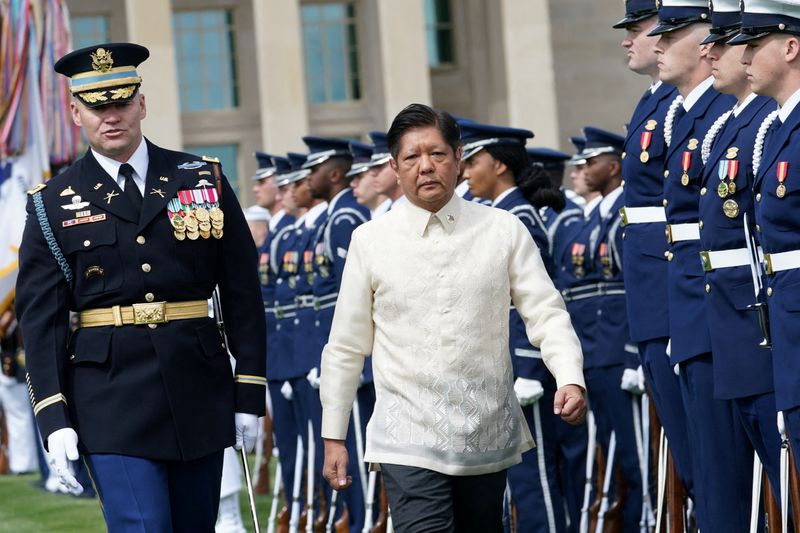 &copy; Reuters. Philippine President Ferdinand Marcos Jr. reviews a military honor guard during a full honors arrival ceremony at the Pentagon in Washington, U.S., May 3, 2023. REUTERS/Kevin Lamarque