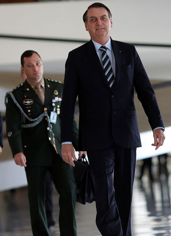 &copy; Reuters. Bolsonaro e seu ajudante de ordens Mauro Cid no Planalto em 2019 
12/03/2019
 REUTERS/Adriano Machado