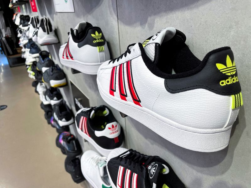 © Reuters. FILE PHOTO: Adidas shoes are seen in an Adidas store on the day the German company terminated its partnership with the American rapper and designer Kanye West, now known as Ye, in Garden City, New York, U.S., October 25, 2022.  REUTERS/Shannon Stapleton