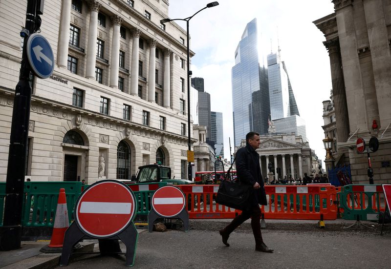 &copy; Reuters. FILE PHOTO: A person walks near to the Bank of England in the City of London financial district in London, Britain, March 23, 2023. REUTERS/Henry Nicholls